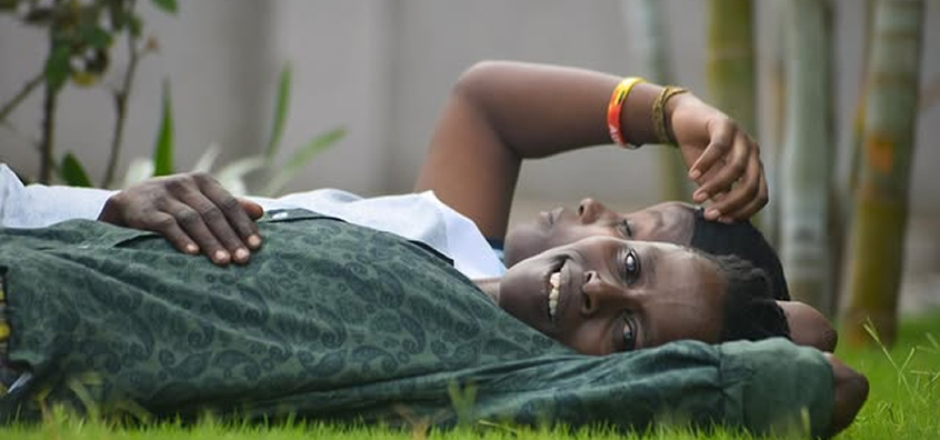 a lady relaxing on grass